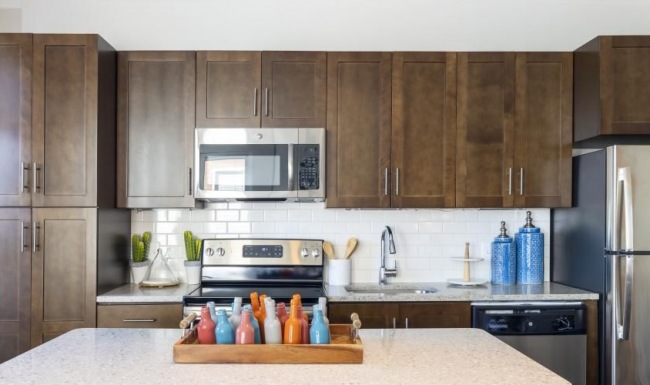 Find your perfect fit at Vy Reston Heights a kitchen with wooden cabinets