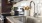 a kitchen with a stainless steel sink