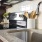 a kitchen with a stainless steel sink