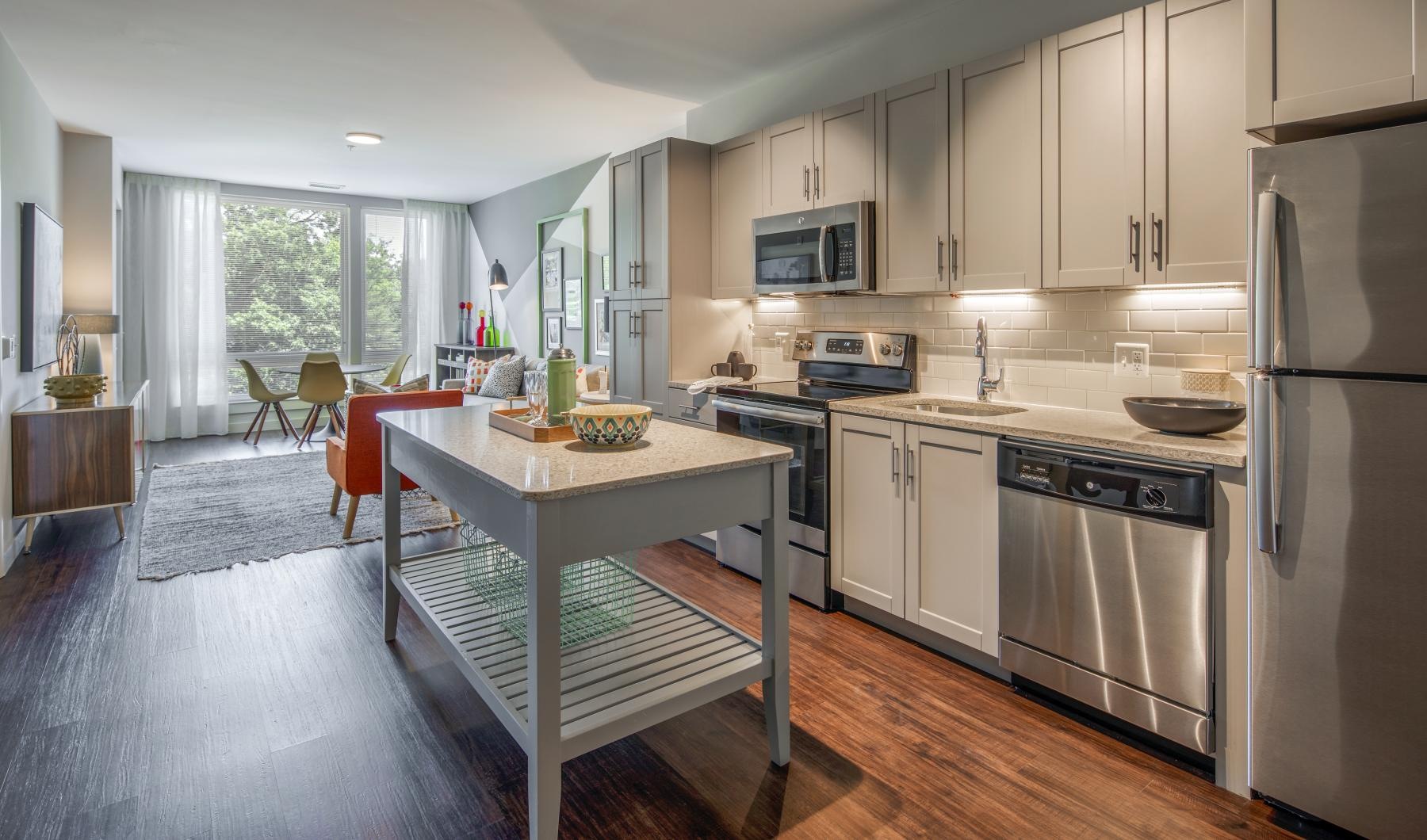 Find your perfect fit at Vy Reston Heights a kitchen with a table and chairs