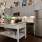 a kitchen with a table and a refrigerator