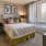 a bedroom with a bed and a desk