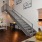a room with a staircase and a table